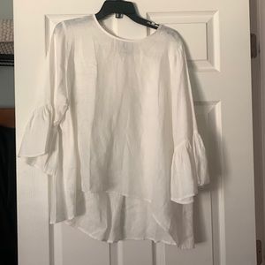 white linen top, 3/4 length sleeve ruffle- material is sheer, back is longer